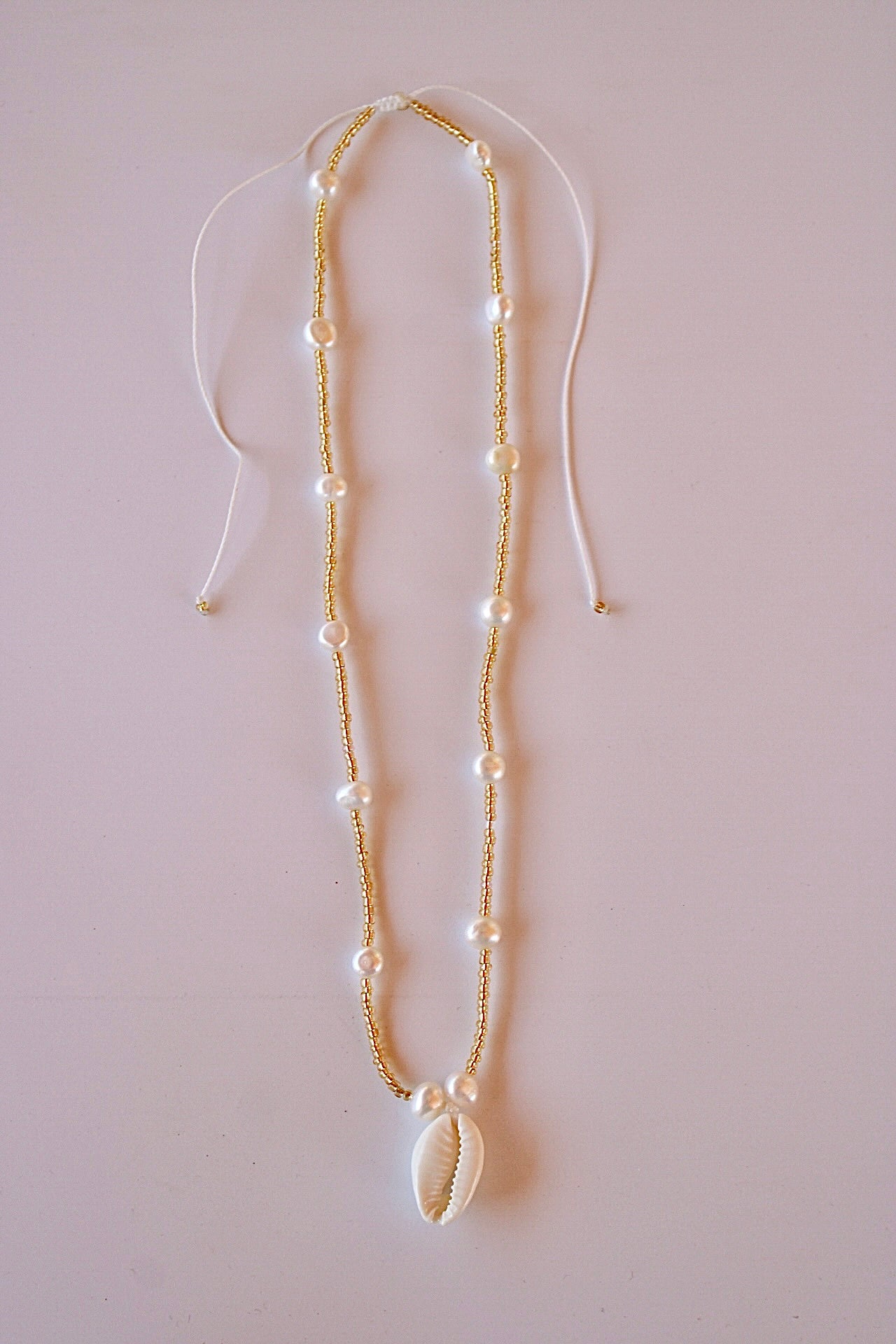 Golden pearl necklace